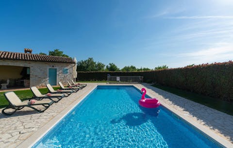 Sip, splash, and sunbathe by the private pool