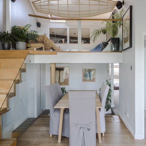 Savour a home cooked meal at the dining table or relax on the mezzanine with its suspended boat