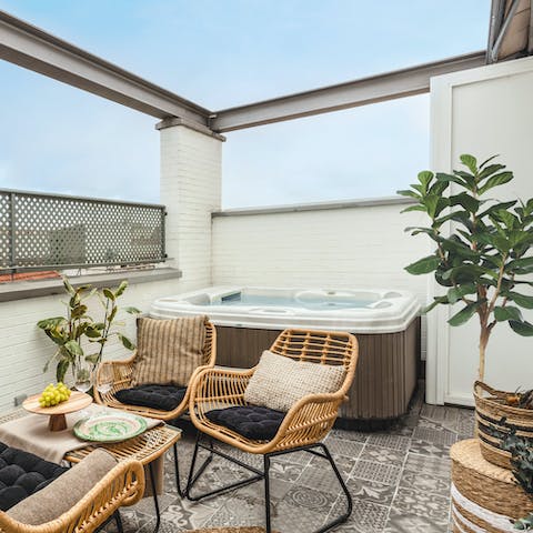 Unwind in the private hot tub, toasting a happy holiday under sunset skies