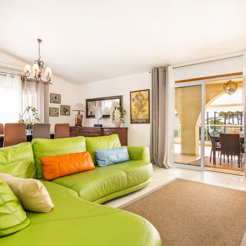 Sink into the comfortable couch inside and enjoy the natural sunlight coming through the glass doors
