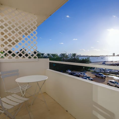 Enjoy a sunset cocktail on your own private balcony with a view of Biscayne Bay