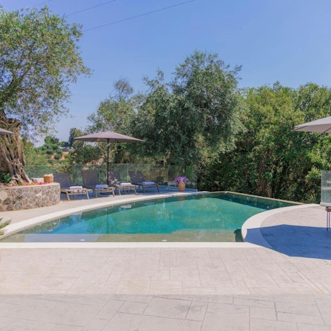 Relax in the Greek sun next to the infinity pool