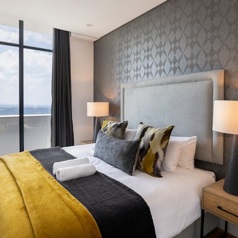 Get a good night's rest in the plush bedroom and wake up to a stunning city view