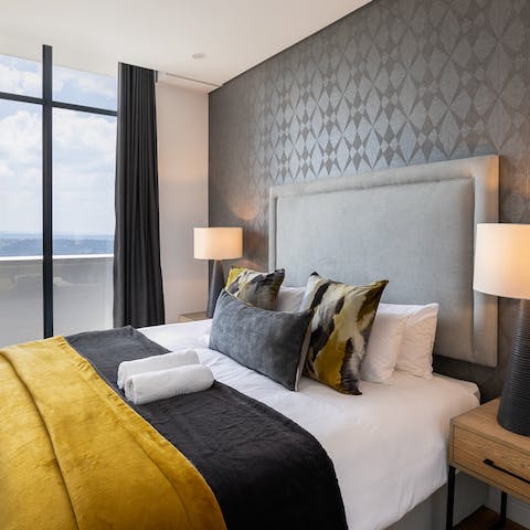 Get a good night's rest in the plush bedroom and wake up to a stunning city view