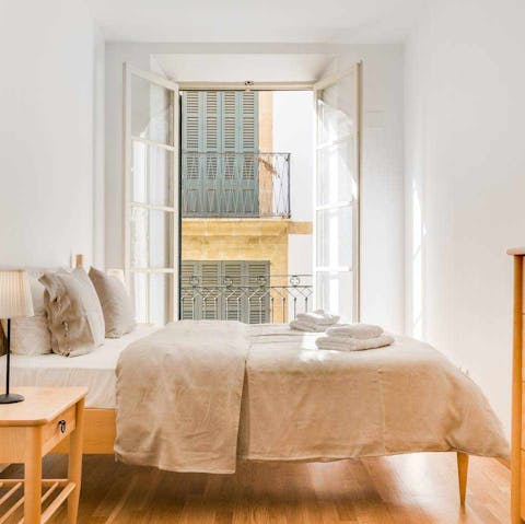 Step out onto the bedroom's balcony as soon as you wake up