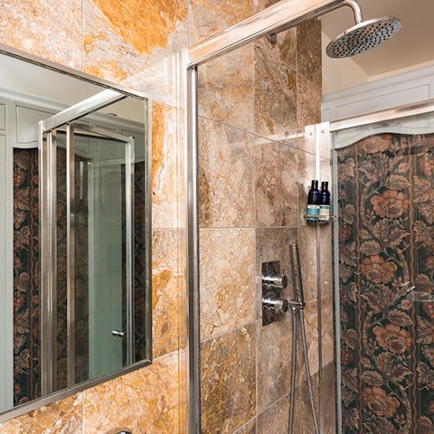 Showering in a floral shower cubicle