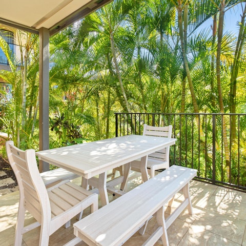 Enjoy meals surrounded by palm trees on the private lanai