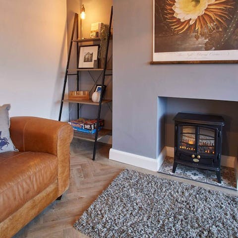 Play boardgames in the cosy living room and stay warm by the fireplace