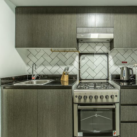 Whip up light bites and late night snacks in the sleek kitchen