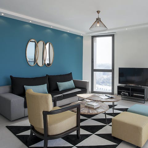 Unwind in your modern and graphic living room with a movie night