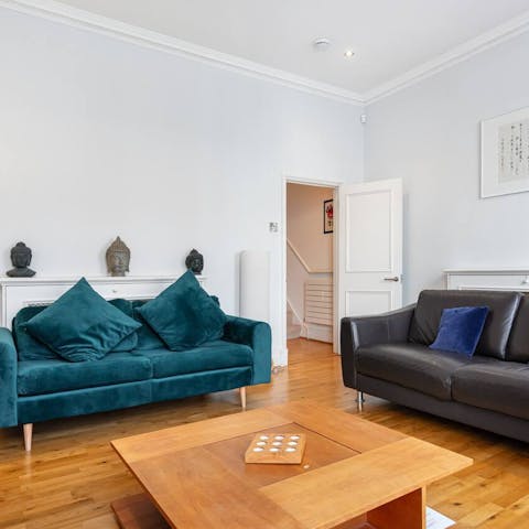 Kick back in the bright living room with a glass of wine after a day of London sightseeing