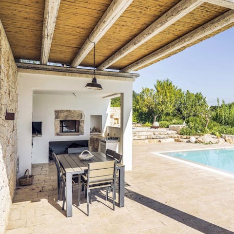Cook in the summer kitchen and enjoy meals on the shaded patio