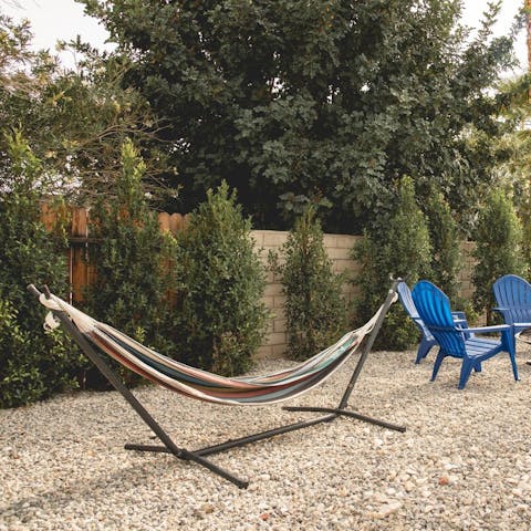 Relax in the secluded hammock with an iced drink in hand