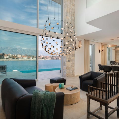 Relax in the striking lounge, where huge windows frame the sea