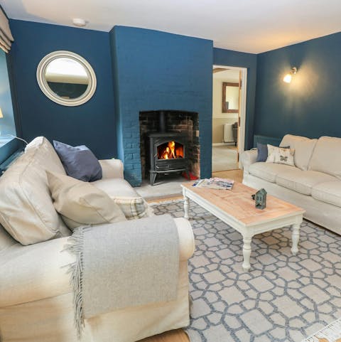 Curl up around the wood-burning stove in the snug