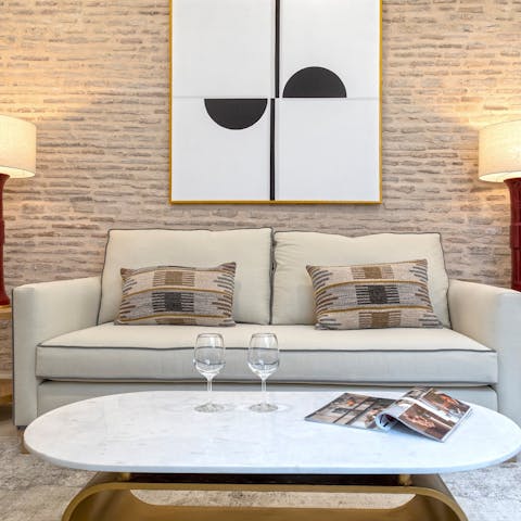 Get cosy on the lovely sofa in the bright living area