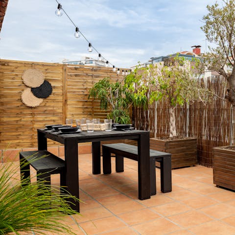 Gather together for alfresco meals on the terrace beneath the glow of the fairy lights