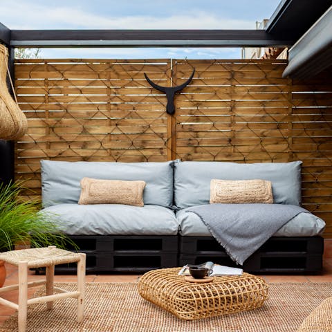 Kick back on the outdoor sofa with a glass of sangria as the sun sets