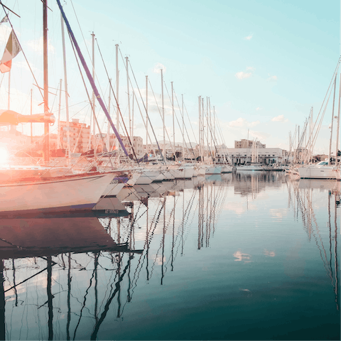 Take a short stroll to the port to sip cocktails in a waterside restaurant