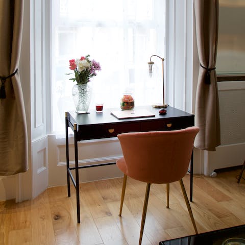 Catch up on work at the laptop-friendly desk in the living room