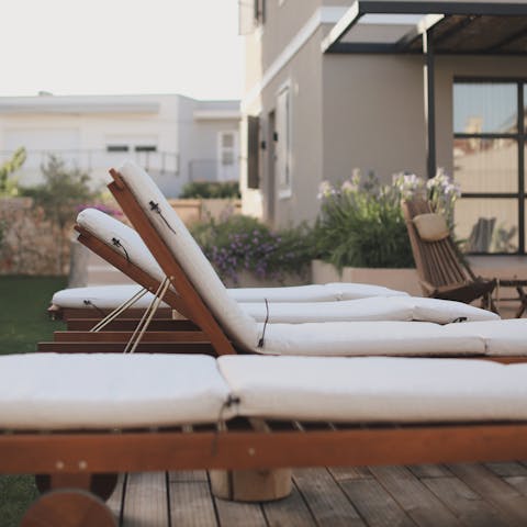 Lie back on a lounger with a good book in hand