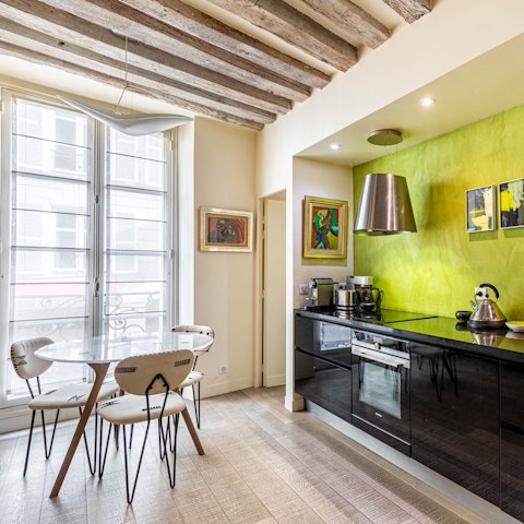 Enjoy croissants and coffee in the cheery dining area