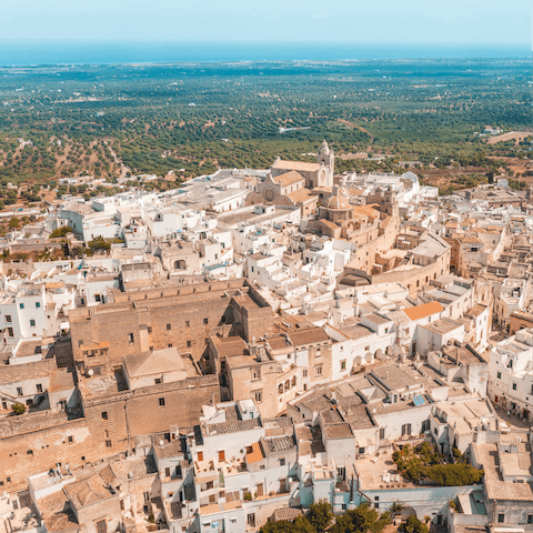 Explore the UNESCO-protected streets of Ostuni, a short drive away