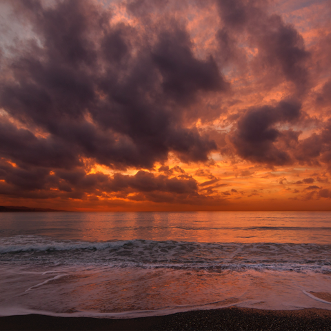 Make the drive to Torrox Beach and spend the day there until after sunset