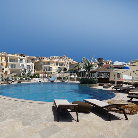 Stretch out by the communal pool for a sun soaking session