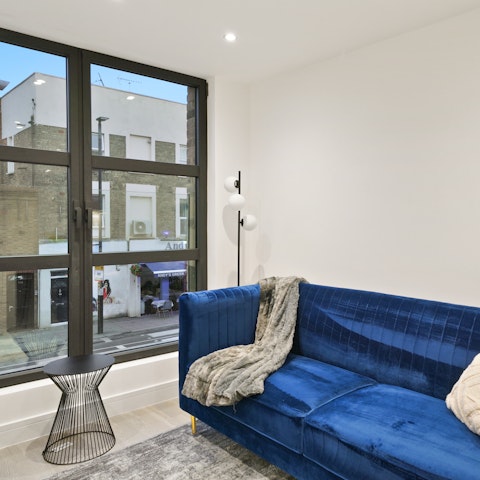 Watch the busy street below from this central home