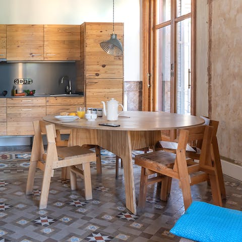 Gather together for homemade tapas at the large wooden dining table