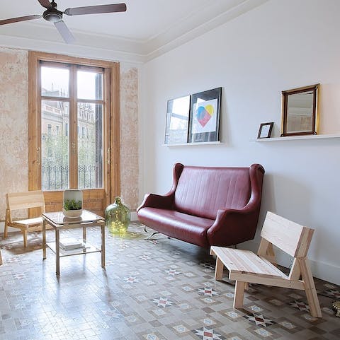 Kick back in the bright living room with a glass of Spanish wine after a busy day of sightseeing