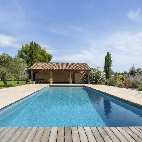 Savour a glass of rosé by the outdoor pool