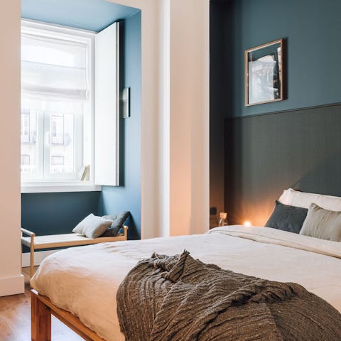 Curl up on the bedroom's window seat with a good book while enjoying the light pouring in through the window
