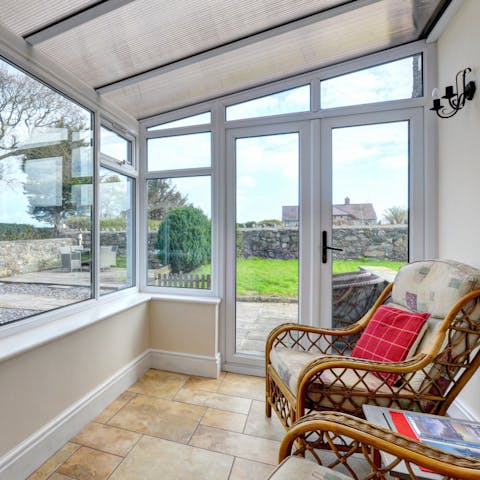Watch the world go by from the sunny conservatory