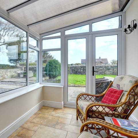 Watch the world go by from the sunny conservatory