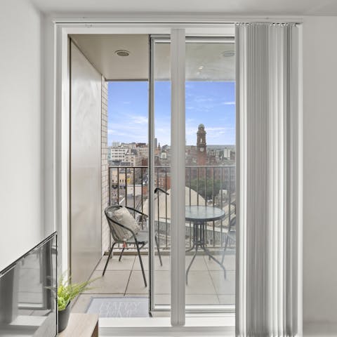 Admire the sweeping city views on the private balcony, the perfect spot to enjoy a glass of wine on a summer evening