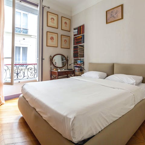 Open the large windows to let the sound of Paris into your bedroom
