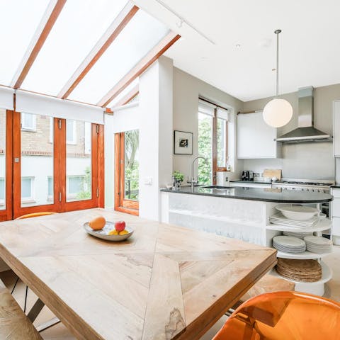Gather at the table for breakfast in the light-filled kitchen-diner