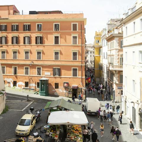 Admire the bustling Roman street views from your window
