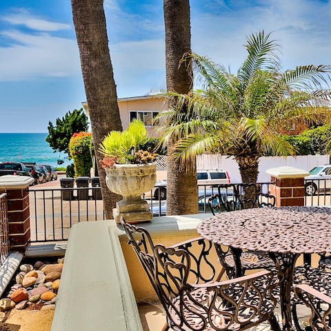 Sip on a cocktail from the patio while you listen to the ocean waves