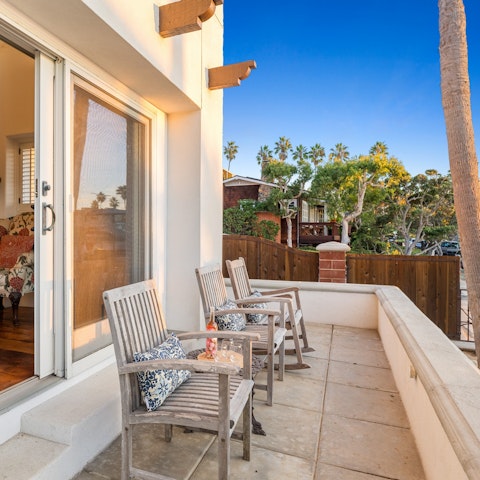 Sip on a cocktail on the patio as the sun goes down