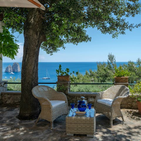 Enjoy a Capri Spritz while admiring the sea views