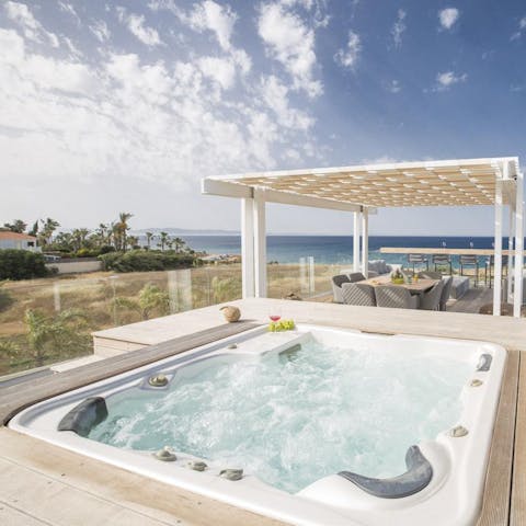Luxuriate in the hot tub up on the rooftop terrace with gorgeous sea views