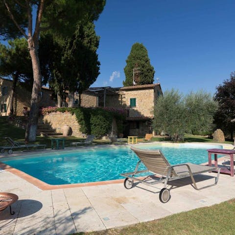 Unwind beside the picturesque pool under the Tuscan sun
