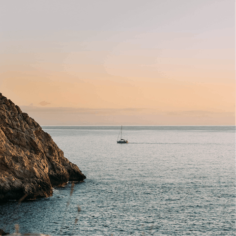 Spend beach days at Cala Santanyí, a seven-minute drive away