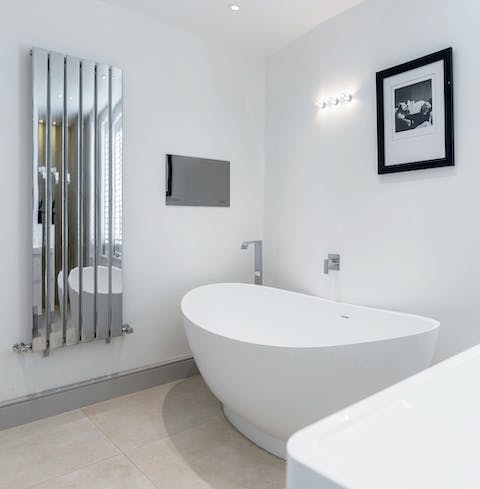 Watch a movie from the comfort of a long, hot bubble bath