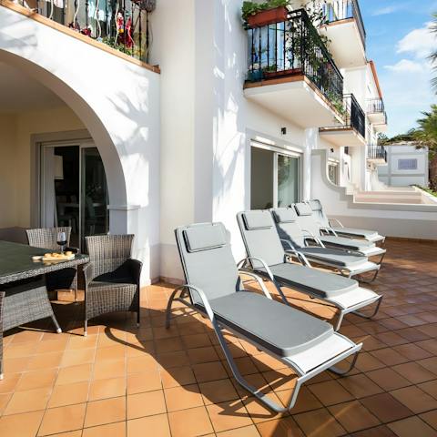 Step out onto the private balcony and lie back on the sun loungers to work on that perfect holiday tan