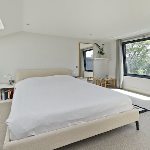 Sleep soundly in your comfortable bedroom with treetop views