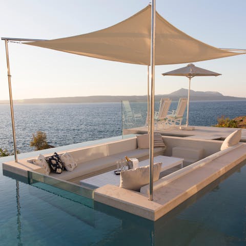 Grab a refreshing drink at the pool's sunken bar and lounge area